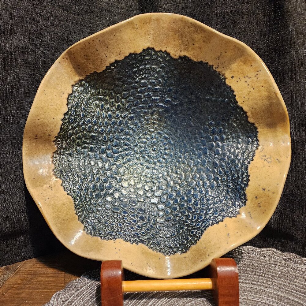 Handmade Ceramic plate with Rustic edge and scale texture.